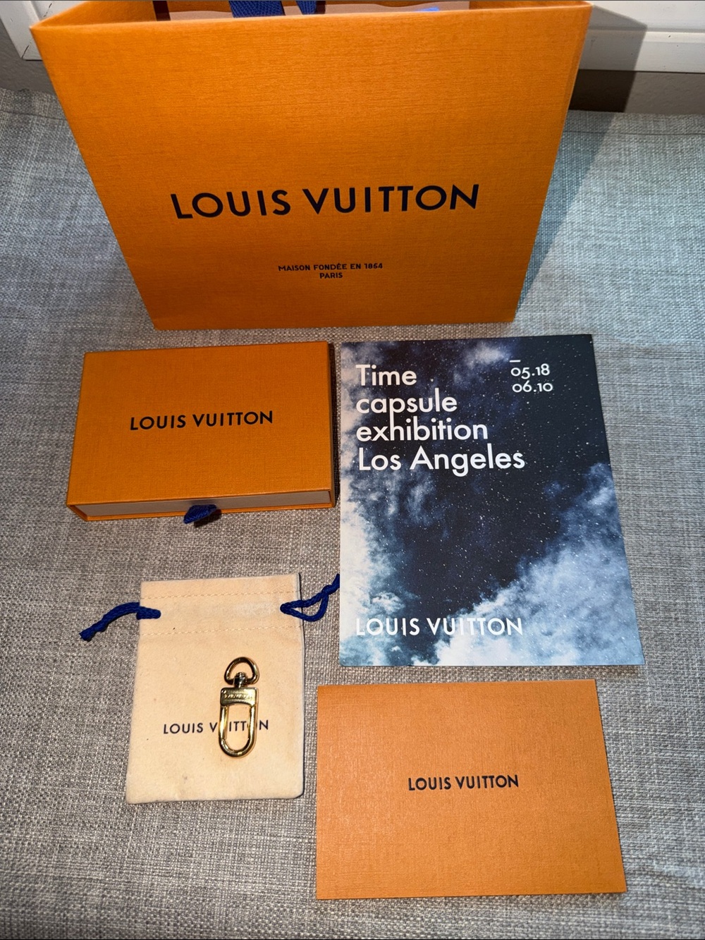 Louis Vuitton charm tag holder in gold